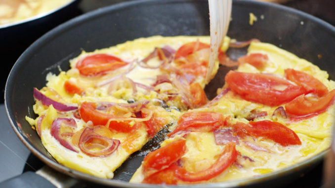 Large omelette with tomatoes