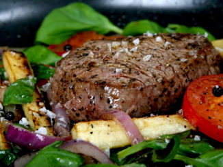 Summer lunch with spring vegetables, cherry tomato and steak