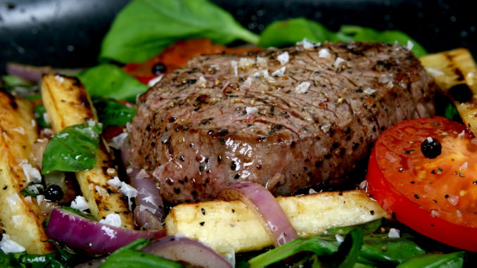 Summer lunch with spring vegetables, cherry tomato and steak