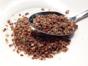 Spoon full of flaxseeds