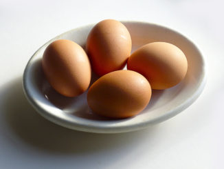 Bowl of four organic eggs