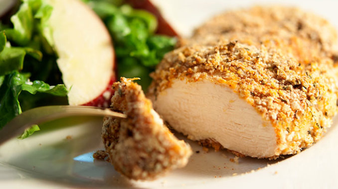 Slice of organic chicken breast in crumbs